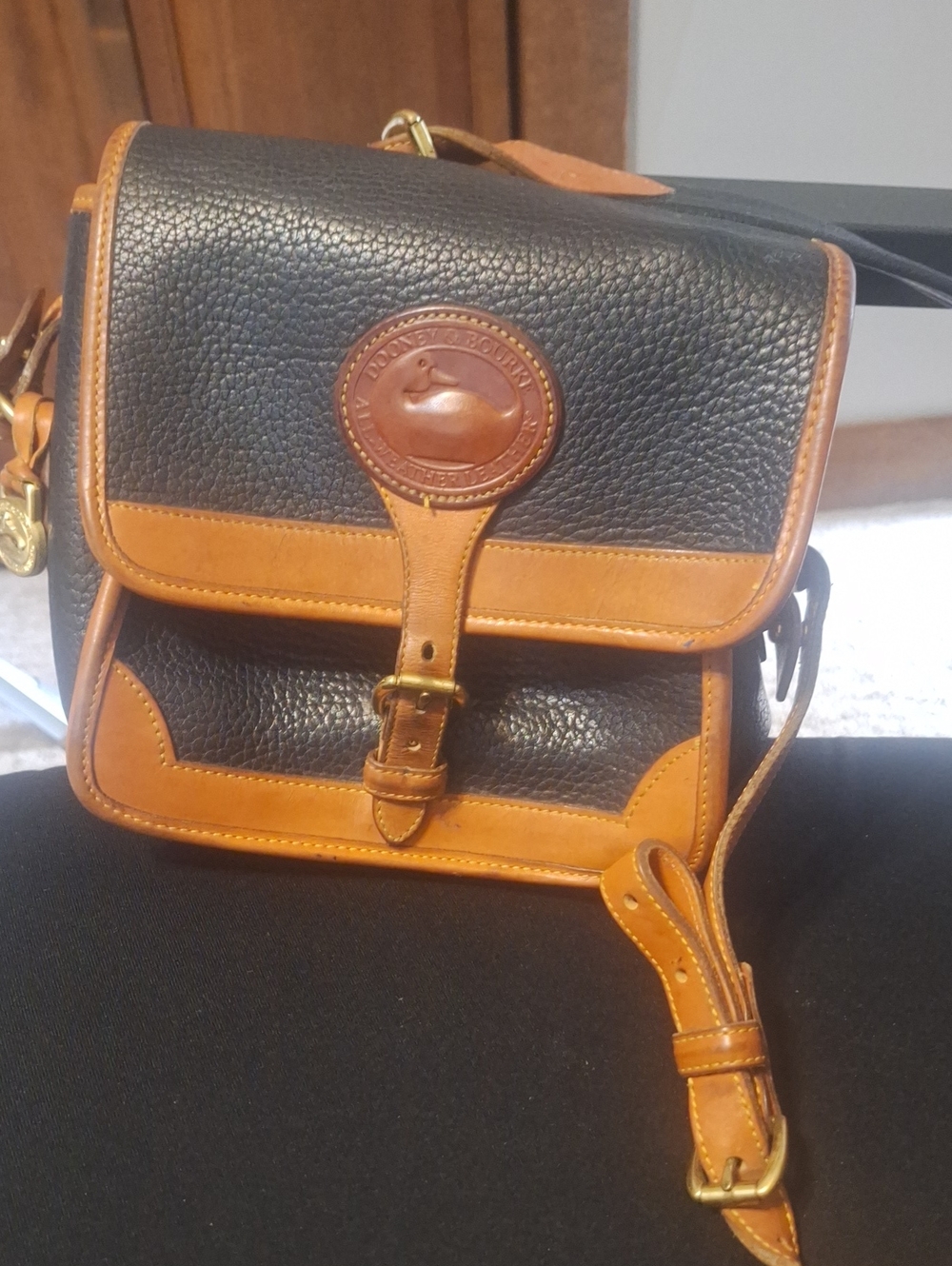 Dooney & Bourke Black and Tan Pebbled Leather Crossbody